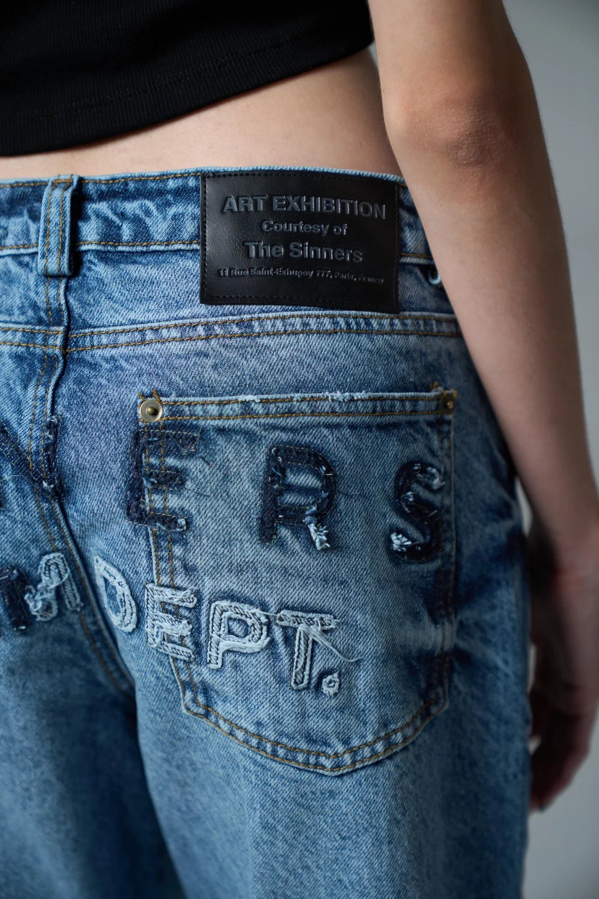 Sinners embroidered flared jeans
